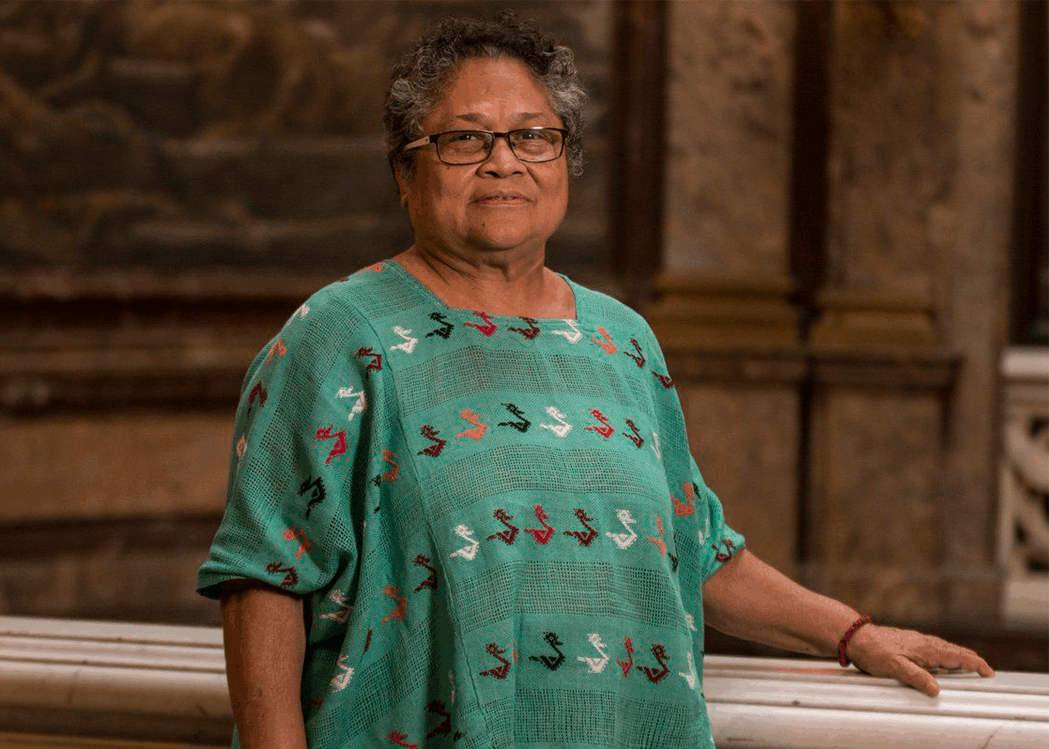 Photo of Myrna Cunningham Kain standing and smiling.