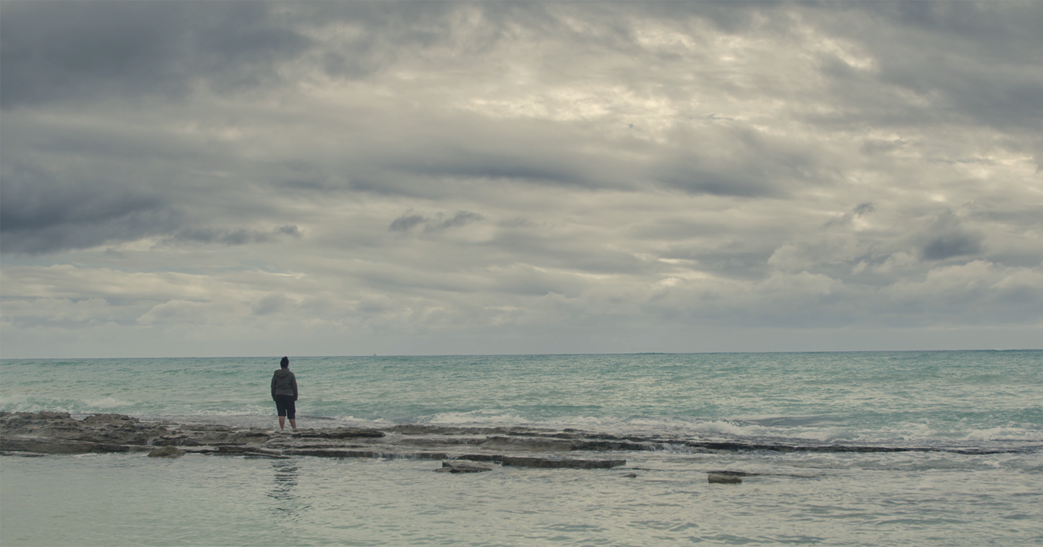 Woman standing on a beach