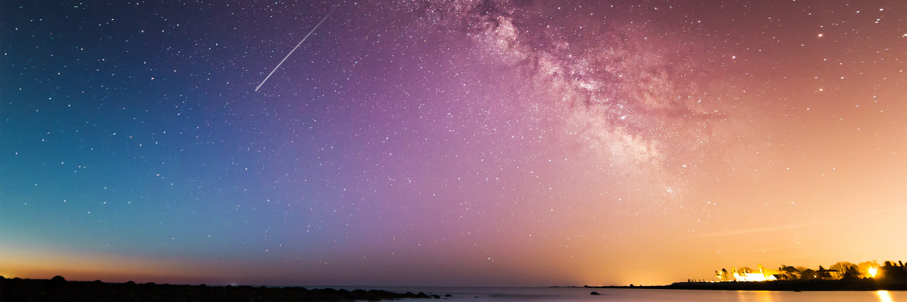 View of a colorful starry sky from the shore